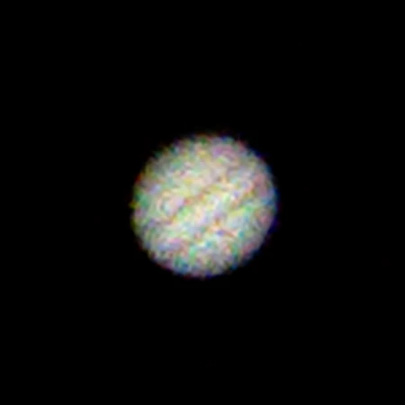 A photo of Jupiter with visible chroma noise.