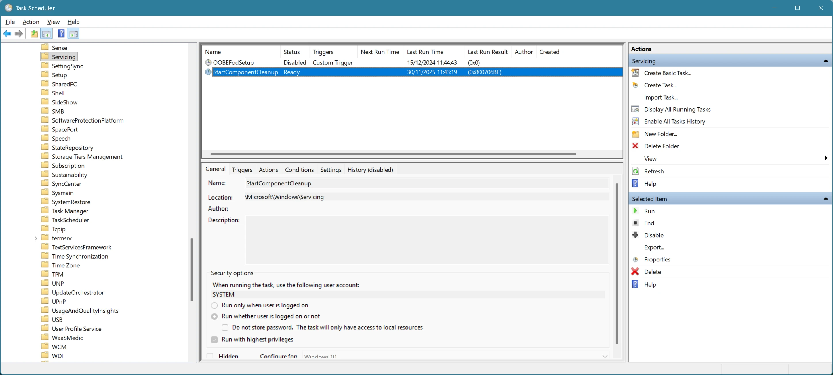 A screenshot of the failing StartComponentCleanup task in Task Scheduler